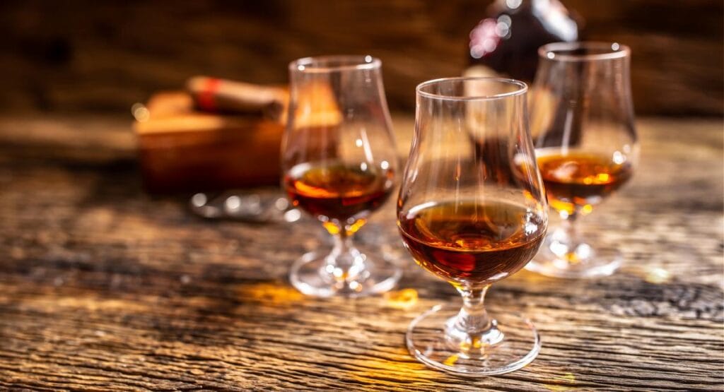 rum in modern glasses with a bottle of rum